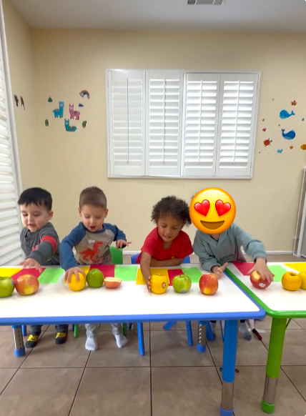 Children with apples at Fairy Tale Child Care