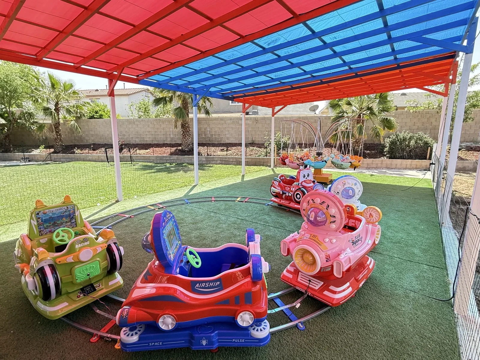 Toddlers Enjoying Ride-On Cars at Fairy Tale Child Care Palmdale